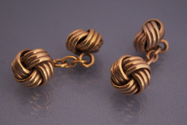 Boutons de manchette or